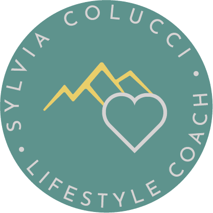 A green circle with the words sylvia colucci lifestyle coach in it.